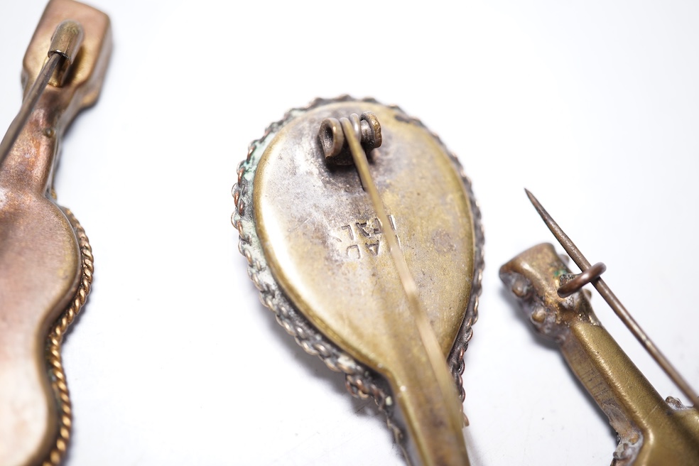 A collection of thirty-one micro-mosaic brooches, including fourteen mixed guitar and banjo shaped brooches, six large oval brooches and seven smaller brooches, three long brooches and a star shaped brooch. Condition - g
